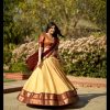 Peaceful Cream Color Kanchipuram Zari Weaving Lehenga Choli