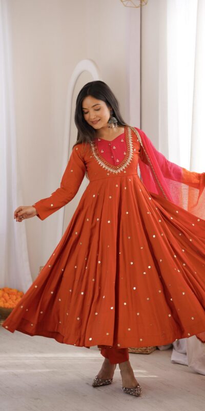 ZF 5023 Rust Roman Silk Gown with Mirror Work & Embroidery Work. Special Price ₹2099. Delivery 4-6 Working Days. Shop now. | Bollywood Gowns, Creative Gowns, Designer Gowns, Embroidered Gowns, Gowns, Party Wear Gowns
