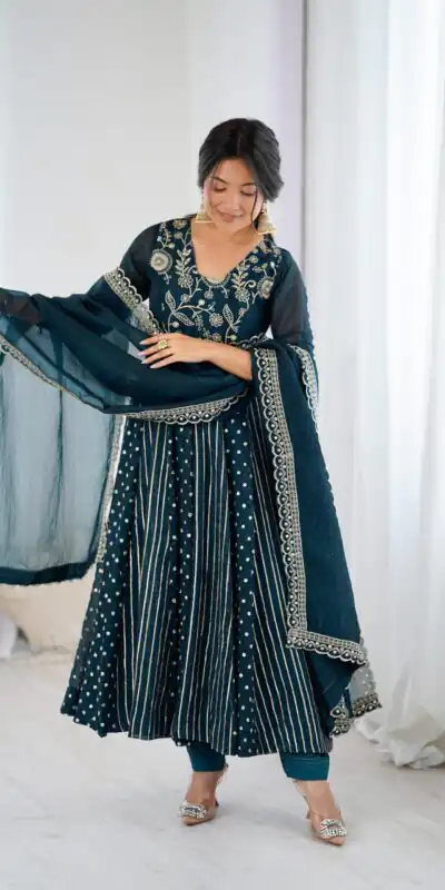 SRK 5293 Peacock Blue With Crunchy Silk With Fully Flair with Lace Work & Embroidery Work Anarkali Gown . Introductory Price ₹2149. Delivery 4-6 Worki | Bollywood Gowns, Creative Gowns, Designer Gowns, Embroidered Gowns, Gowns, Party Wear Gowns