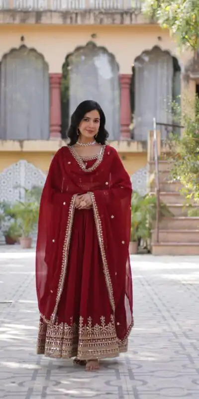 KA 1144 Maroon Faux Blooming Gown with Embroidery Work & Zari Work. Exclusive Offer ₹2449. Delivery 4-6 Working Days. Shop now. | Bollywood Gowns, Creative Gowns, Designer Gowns, Embroidered Gowns, Gowns, Party Wear Gowns
