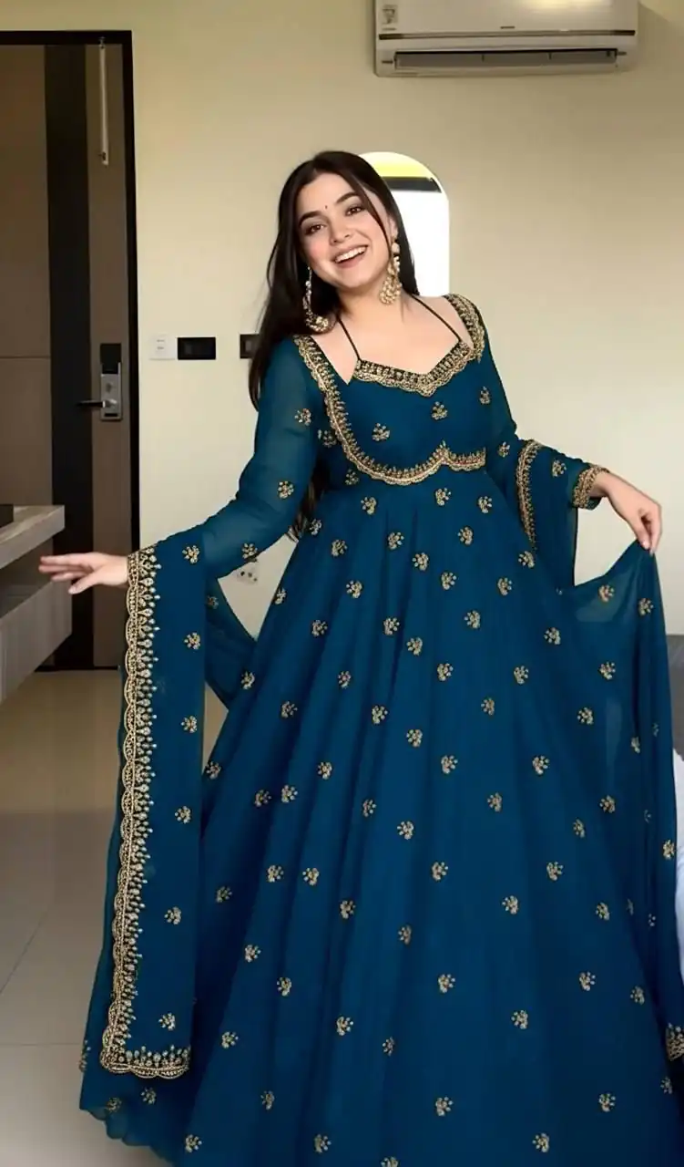 MF 1003 Peacock Blue Georgette Gown. Perfect for Wedding, Party, Pongal, Bridal Wear, Anniversary Price ₹1799. Delivery 4-6 Working Days. Shop now. | Bollywood Gowns, Creative Gowns, Designer Gowns, Embroidered Gowns, Gowns, Party Wear Gowns