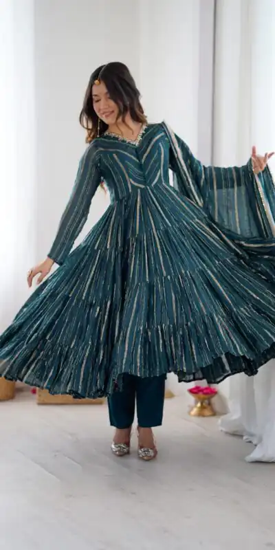 SRK 5305 Peacock Blue Color Mal Chanderi Gown with Mirror Work & Lace Work. Grab it for ₹2399. Delivery 4-6 Working Days. Shop now. | Bollywood Gowns, Creative Gowns, Designer Gowns, Embroidered Gowns, Gowns, Party Wear Gowns