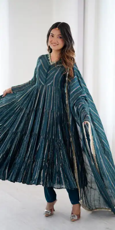 SRK 5305 Peacock Blue Color Mal Chanderi Gown with Mirror Work & Lace Work. Grab it for ₹2399. Delivery 4-6 Working Days. Shop now. | Bollywood Gowns, Creative Gowns, Designer Gowns, Embroidered Gowns, Gowns, Party Wear Gowns