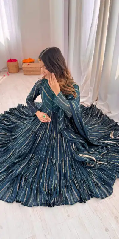 SRK 5305 Peacock Blue Color Mal Chanderi Gown with Mirror Work & Lace Work. Grab it for ₹2399. Delivery 4-6 Working Days. Shop now. | Bollywood Gowns, Creative Gowns, Designer Gowns, Embroidered Gowns, Gowns, Party Wear Gowns
