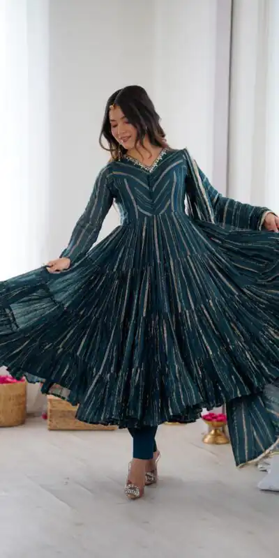 SRK 5305 Peacock Blue Color Mal Chanderi Gown with Mirror Work & Lace Work. Grab it for ₹2399. Delivery 4-6 Working Days. Shop now. | Bollywood Gowns, Creative Gowns, Designer Gowns, Embroidered Gowns, Gowns, Party Wear Gowns