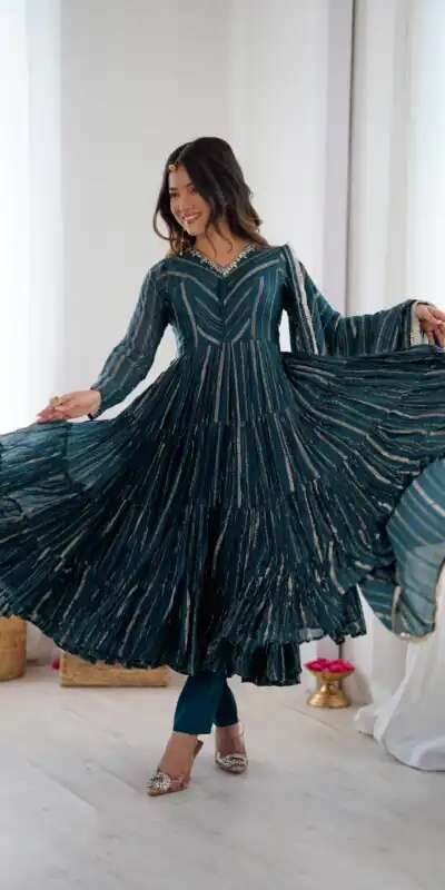 SRK 5305 Peacock Blue Color Mal Chanderi Gown with Mirror Work & Lace Work. Grab it for ₹2399. Delivery 4-6 Working Days. Shop now. | Bollywood Gowns, Creative Gowns, Designer Gowns, Embroidered Gowns, Gowns, Party Wear Gowns