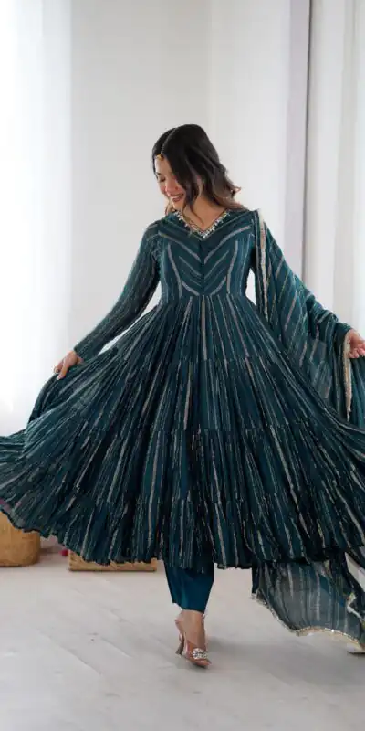 SRK 5305 Peacock Blue Color Mal Chanderi Gown with Mirror Work & Lace Work. Grab it for ₹2399. Delivery 4-6 Working Days. Shop now. | Bollywood Gowns, Creative Gowns, Designer Gowns, Embroidered Gowns, Gowns, Party Wear Gowns