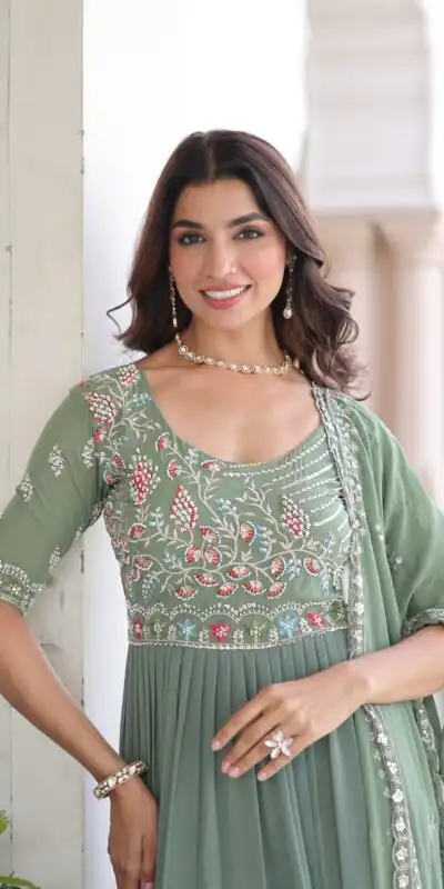 KA 1213 Pista Faux Blooming Gown with Embroidery Work & Sequins Work. Best Price ₹2449. Delivery 4-6 Working Days. Shop now. | Bollywood Gowns, Creative Gowns, Designer Gowns, Embroidered Gowns, Gowns, Party Wear Gowns