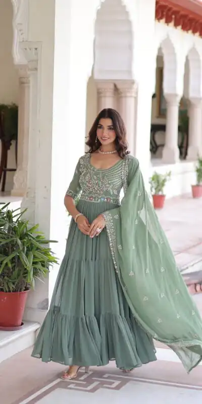 KA 1213 Pista Faux Blooming Gown with Embroidery Work & Sequins Work. Best Price ₹2449. Delivery 4-6 Working Days. Shop now. | Bollywood Gowns, Creative Gowns, Designer Gowns, Embroidered Gowns, Gowns, Party Wear Gowns