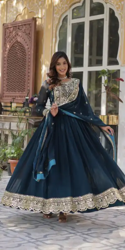 KA 1153 Teal Faux Blooming Gown with Embroidery Work & Zari Work. Available at ₹2599 only. Delivery 4-6 Working Days. Shop now. | Bollywood Gowns, Creative Gowns, Designer Gowns, Embroidered Gowns, Gowns, Party Wear Gowns