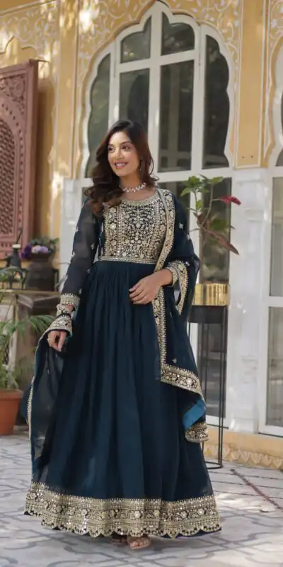 KA 1153 Teal Faux Blooming Gown with Embroidery Work & Zari Work. Available at ₹2599 only. Delivery 4-6 Working Days. Shop now. | Bollywood Gowns, Creative Gowns, Designer Gowns, Embroidered Gowns, Gowns, Party Wear Gowns