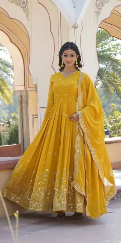KA 1084 Yellow Faux Georgette Gown Perfect for Wedding, Party, Pooja, Festival Celebrations, Bridal Wear – . Festive Deal ₹2649. Delivery 4-6 Working | Bollywood Gowns, Creative Gowns, Designer Gowns, Embroidered Gowns, Gowns, Party Wear Gowns