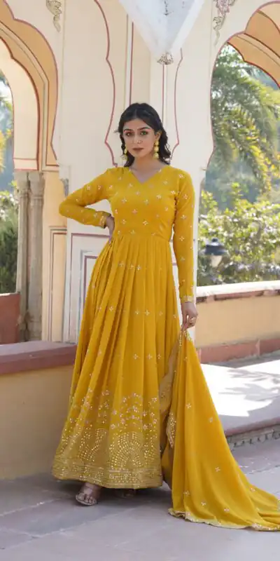 KA 1084 Yellow Faux Georgette Gown Perfect for Wedding, Party, Pooja, Festival Celebrations, Bridal Wear – . Festive Deal ₹2649. Delivery 4-6 Working | Bollywood Gowns, Creative Gowns, Designer Gowns, Embroidered Gowns, Gowns, Party Wear Gowns