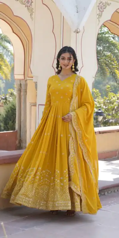 KA 1084 Yellow Faux Georgette Gown Perfect for Wedding, Party, Pooja, Festival Celebrations, Bridal Wear – . Festive Deal ₹2649. Delivery 4-6 Working | Bollywood Gowns, Creative Gowns, Designer Gowns, Embroidered Gowns, Gowns, Party Wear Gowns