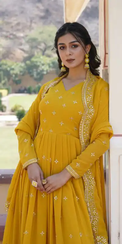 KA 1084 Yellow Faux Georgette Gown Perfect for Wedding, Party, Pooja, Festival Celebrations, Bridal Wear – . Festive Deal ₹2649. Delivery 4-6 Working | Bollywood Gowns, Creative Gowns, Designer Gowns, Embroidered Gowns, Gowns, Party Wear Gowns