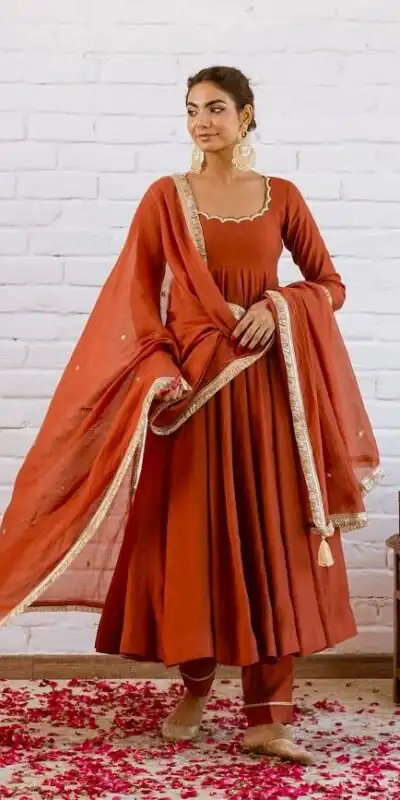 SRk 5324 Rust Color Vichitra silk Gown with Bead Work & Lace Work. Now at just ₹1849. Delivery 4-6 Working Days. Shop now. | Bollywood Gowns, Creative Gowns, Designer Gowns, Embroidered Gowns, Gowns, Party Wear Gowns
