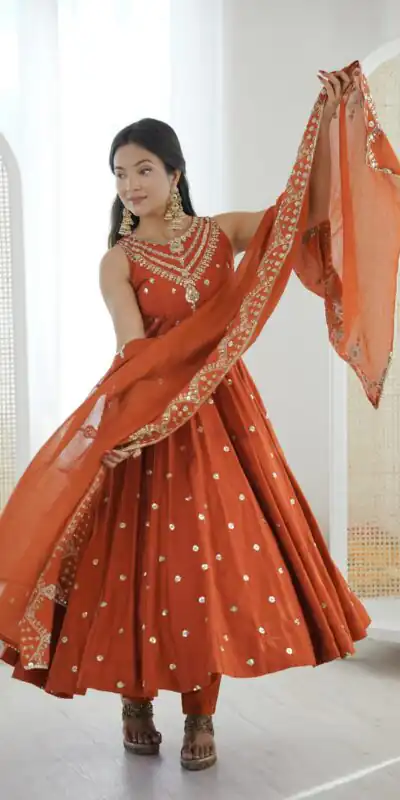 JF 038 Rust Roman Silk Gown with Embroidery Work. Wedding, Party, Festive, Events, Navratri, Exclusive Offer ₹2149. Delivery 4-6 Working Days. Shop now. | Bollywood Gowns, Creative Gowns, Designer Gowns, Embroidered Gowns, Gowns, Party Wear Gowns