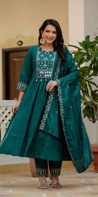 DIVA 126 Teal Viscose Roman Silk Anarkali Suit with Mirror Work & Embroidery Work. Affordable Price ₹2049. Delivery 4-6 Working Days. Shop now. | Anarkali Suits, Bollywood Anarkali, Creative-Anarkali, Designer Anarkali, Embroidered Anarkali, Party Wear Anarkali