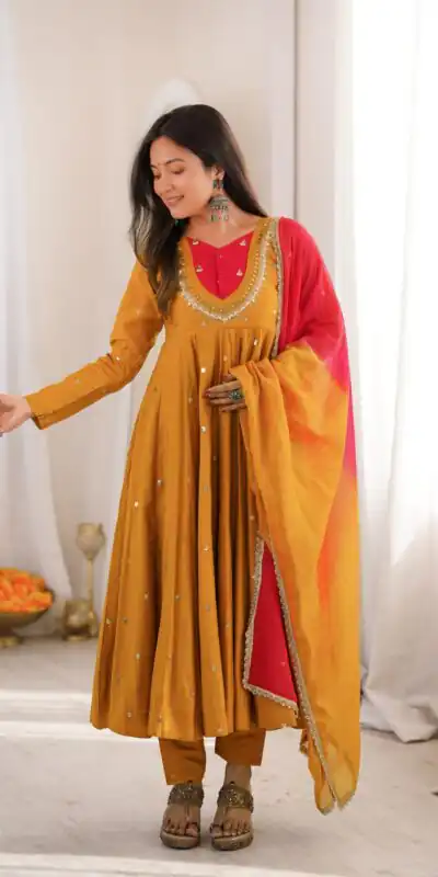ZF 5023 Mustered Roman Silk Gown with Mirror Work & Embroidery Work. Special Price ₹2099. Delivery 4-6 Working Days. Shop now. | Bollywood Gowns, Creative Gowns, Designer Gowns, Embroidered Gowns, Gowns, Party Wear Gowns
