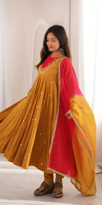 ZF 5023 Mustered Roman Silk Gown with Mirror Work & Embroidery Work. Special Price ₹2099. Delivery 4-6 Working Days. Shop now. | Bollywood Gowns, Creative Gowns, Designer Gowns, Embroidered Gowns, Gowns, Party Wear Gowns