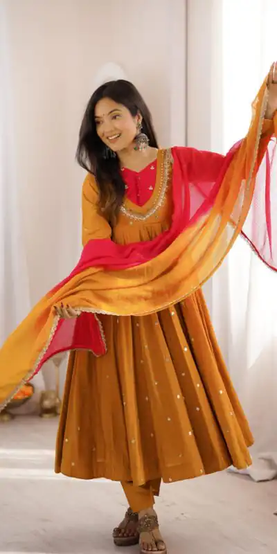 ZF 5023 Mustered Roman Silk Gown with Mirror Work & Embroidery Work. Special Price ₹2099. Delivery 4-6 Working Days. Shop now. | Bollywood Gowns, Creative Gowns, Designer Gowns, Embroidered Gowns, Gowns, Party Wear Gowns