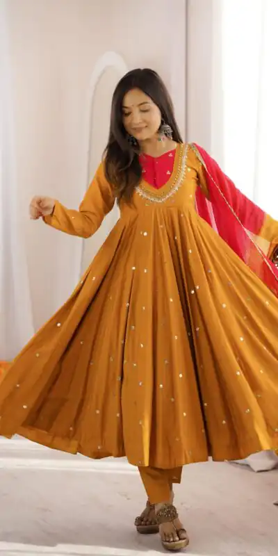 ZF 5023 Mustered Roman Silk Gown with Mirror Work & Embroidery Work. Special Price ₹2099. Delivery 4-6 Working Days. Shop now. | Bollywood Gowns, Creative Gowns, Designer Gowns, Embroidered Gowns, Gowns, Party Wear Gowns