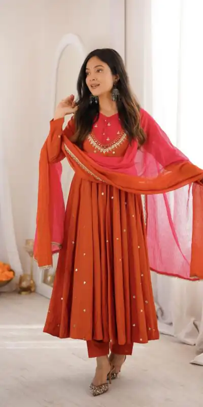 ZF 5023 Rust Roman Silk Gown with Mirror Work & Embroidery Work. Special Price ₹2099. Delivery 4-6 Working Days. Shop now. | Bollywood Gowns, Creative Gowns, Designer Gowns, Embroidered Gowns, Gowns, Party Wear Gowns