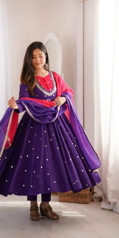 ZF 5023 Purple Roman Silk Gown with Mirror Work & Embroidery Work. Special Price ₹2099. Delivery 4-6 Working Days. Shop now. | Bollywood Gowns, Creative Gowns, Designer Gowns, Embroidered Gowns, Gowns, Party Wear Gowns