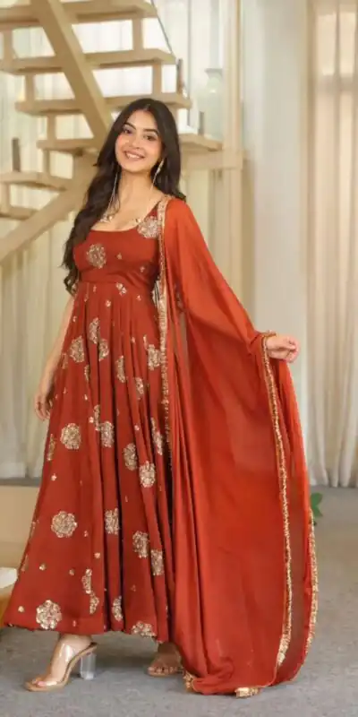 ZSR 3189 Rust Doremon Crush Gown with Lace Work & Mirror Work. Exclusive Offer ₹2399. Delivery 4-6 Working Days. Shop now. | Bollywood Gowns, Creative Gowns, Designer Gowns, Embroidered Gowns, Gowns, Party Wear Gowns