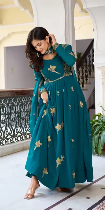 SP 30 Teal Faux Georgette Gown with Mirror Work & Embroidery Work. Get it for ₹1799. Delivery 4-6 Working Days. Online Shop now. | Bollywood Gowns, Creative Gowns, Designer Gowns, Embroidered Gowns, Gowns, Party Wear Gowns