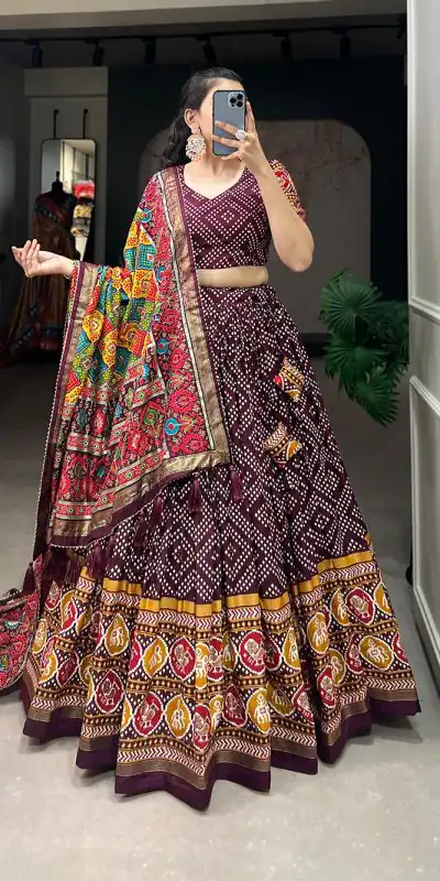 Angelic Wine Color Tussar Silk With Heavy Tassels patola printed  Lehenga Choli